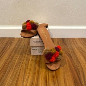 BCBGeneration Women's Sandals with Colorful Pom-Poms